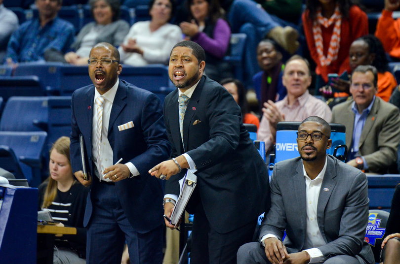 Vonn Read and Cedric Solice, both on SU's coaching staff, jump off the bench to bark commands to the Orange.