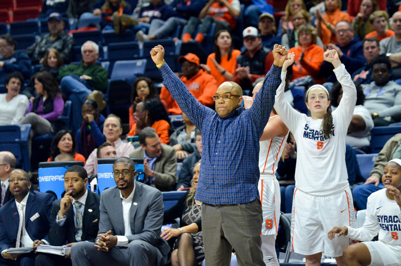 Hillsman raises both fists. His team advanced to the Round of 32 for the fourth straight year.