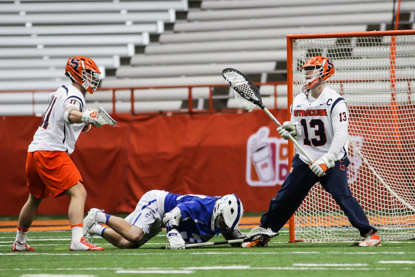 Molloy stands over a Duke defender who fell. 