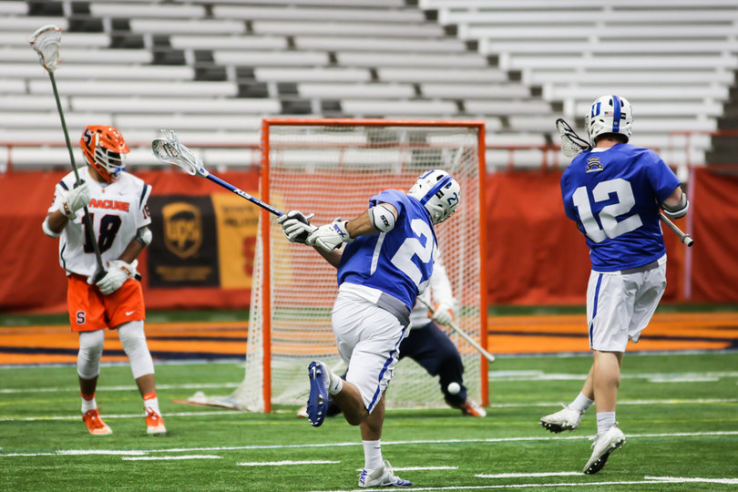 Brad Smith fires a ball low toward Molloy. 