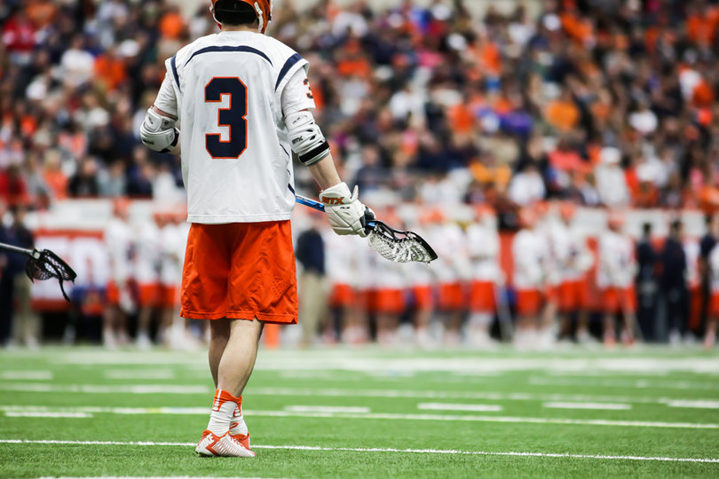 Nate Solomon stands alone in the middle of the field. 