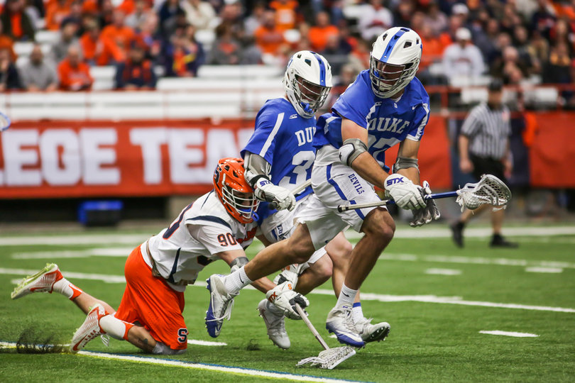 Austin Fusco runs into a few Duke players while trying to steal the ball. 