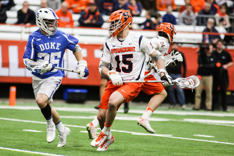 Carlin tries to play keep-away from a Duke defender. 