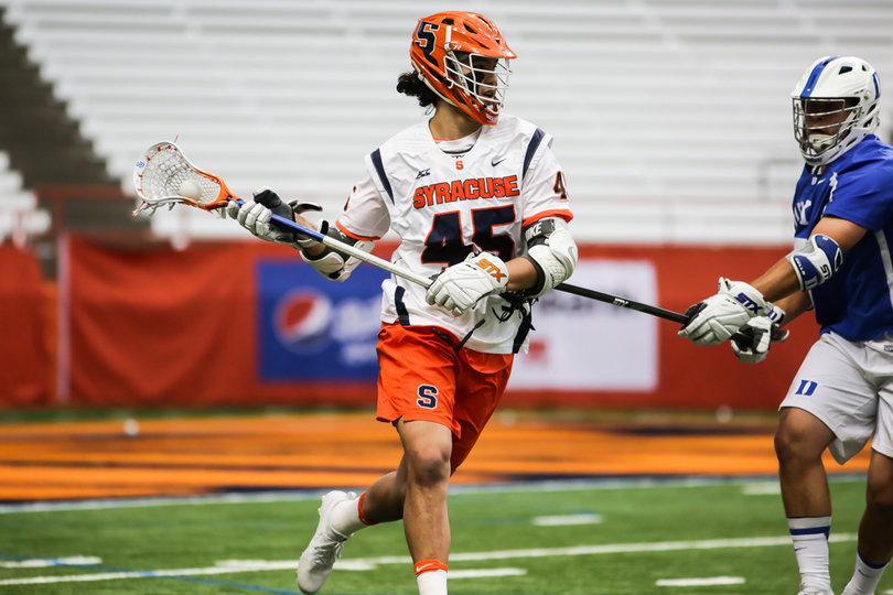 Bomberry fights through a stick check. He finished with two goals and an assist. 