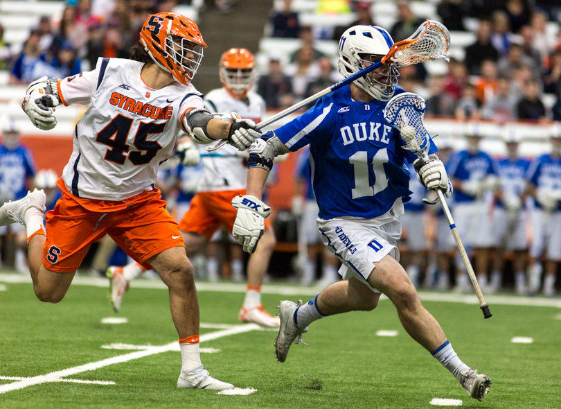 Bomberry tries to pry the ball away from Duke's Terry Lindsay. 