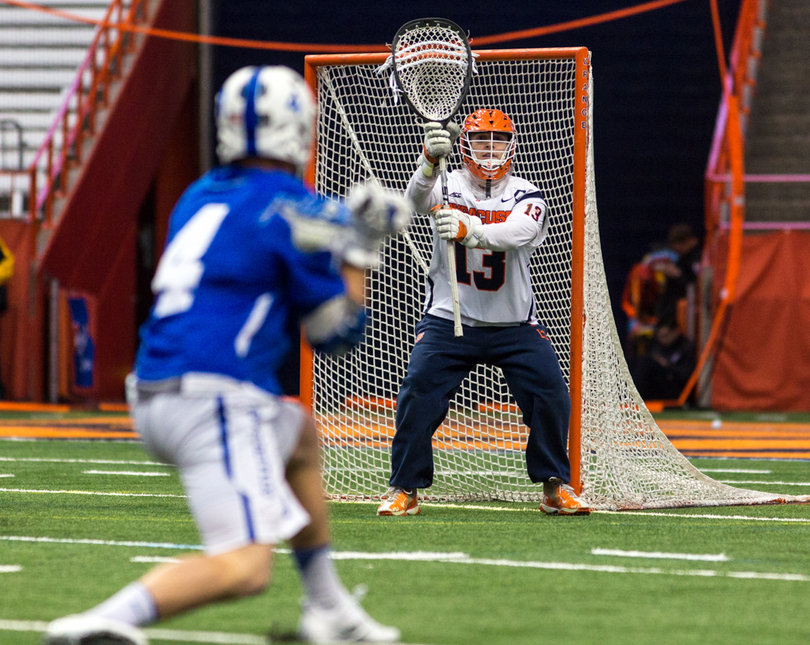 Evan Molloy gets ready to face a shot from Mitch Russell. 