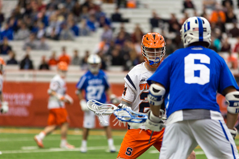 Duke's John Prendergast tries to put a move on a Syracuse defender. 