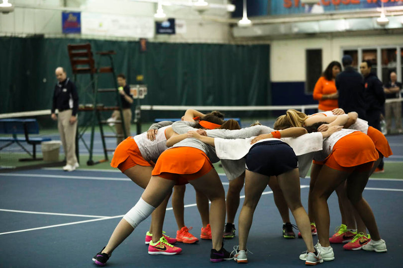 Syracuse players huddle up before the start of the game. 