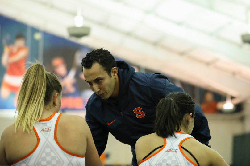 Head coach Younes Limam talks to his players. 