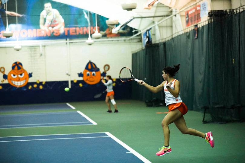Ramirez fires a forehand return. 