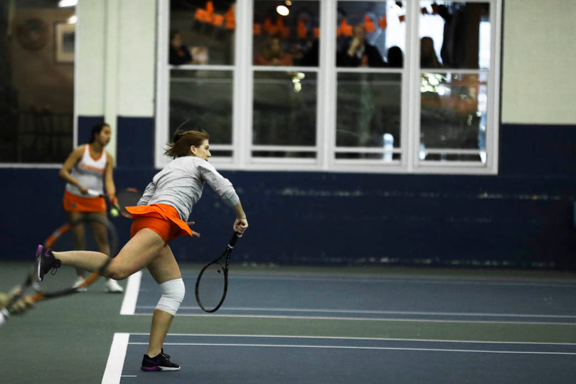 Shkudun follows through, landing on her wrapped-up right knee. 