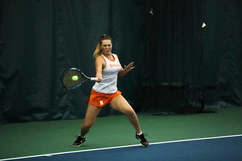 Knutson pounds a forehand through. 