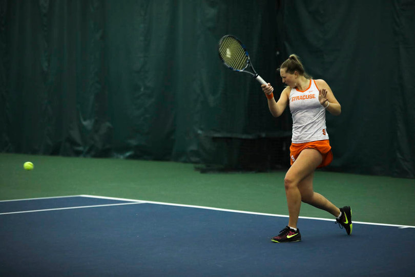 Knutson returns a forehand from the right side. 