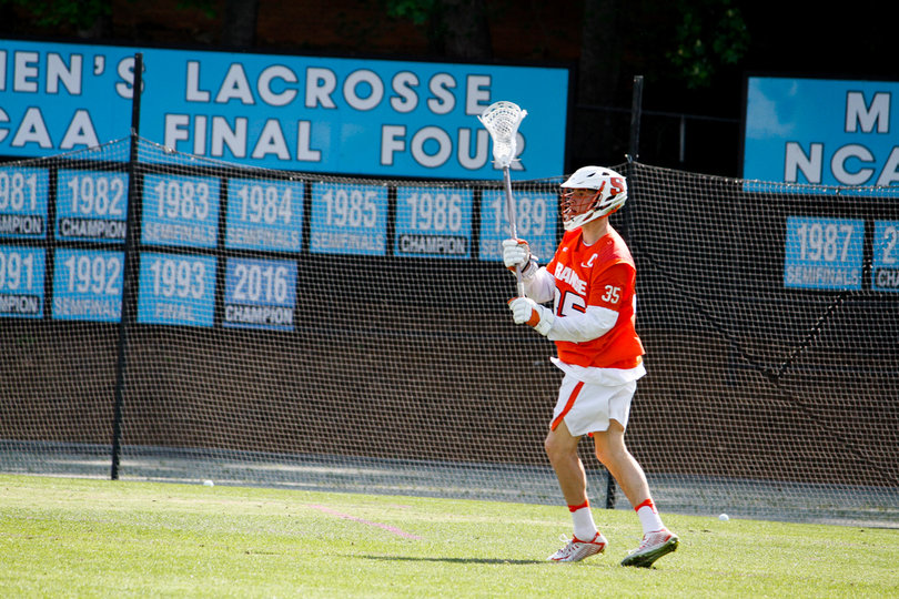 Ciferri holds his stick up high. 