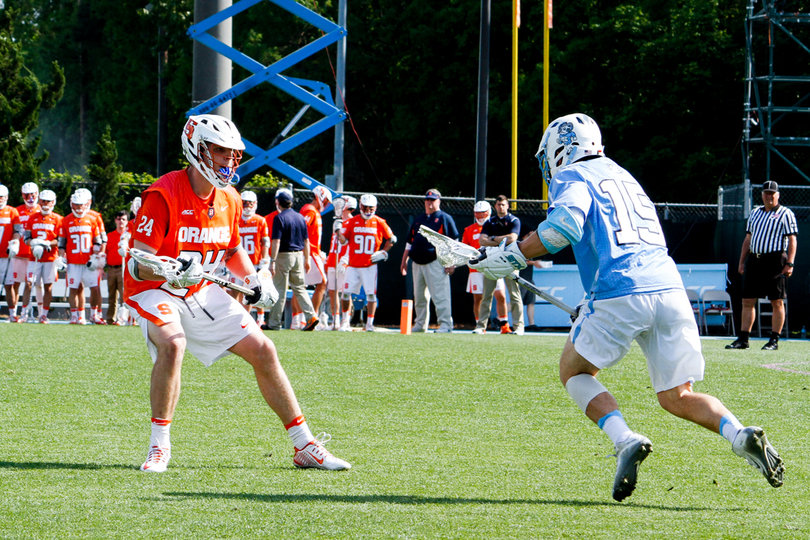 SU's Kevin Hutchings defends UNC's Timmy Kelly.