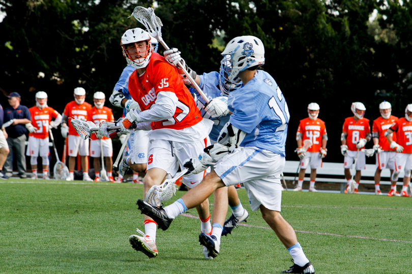 Paolo Ciferri tries to split the ball between two defenders. 