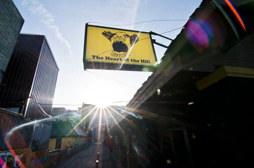 The sun sets behind the iconic Hungry Chuck's sign. 