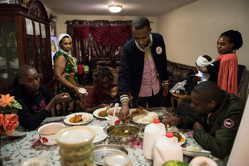 Every refugee settled by Interfaith Works enjoys a first meal with their host family.