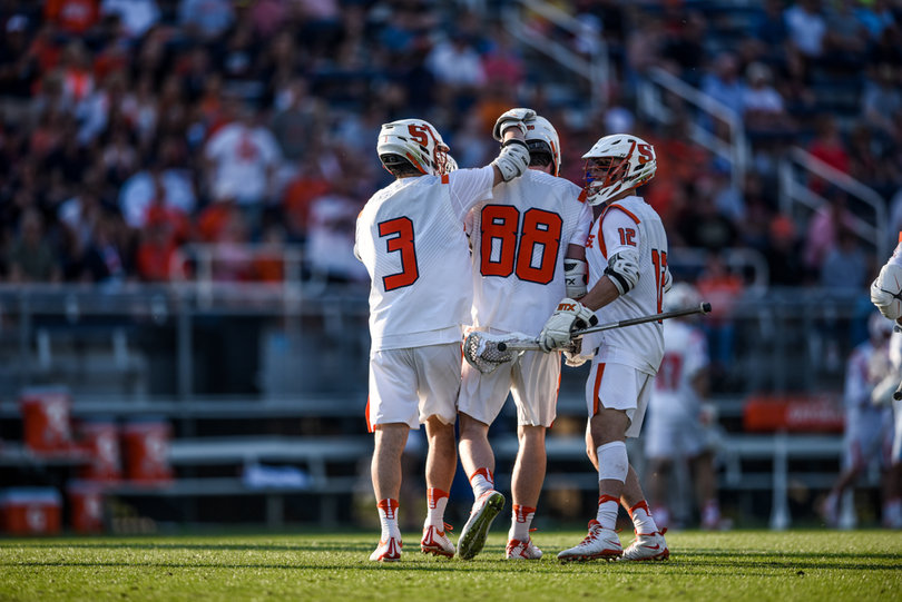 Nate Solomon puts his hand on Helmer's helmet. The opening-round loss marks SU's first since joining the ACC.