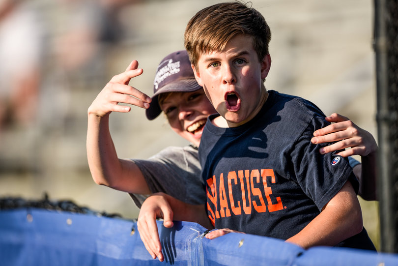 Fans cheer for Syracuse in the opening game of the ACC tournament. 