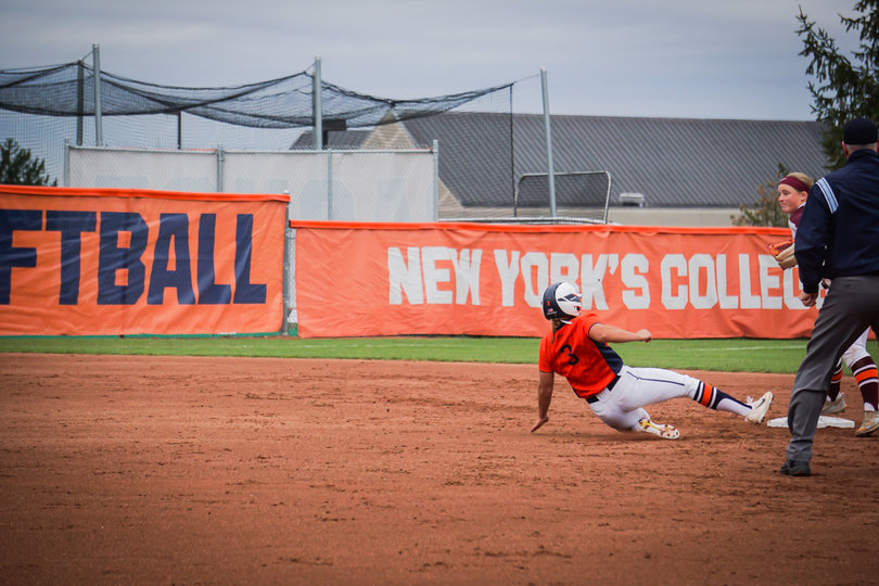 Jessica Heese slides into second base, trying to get in before the VT player touches the bag. 