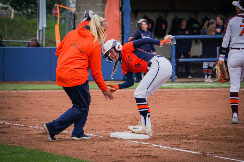 Alicia Hansen high fives assistant coach Kristyn Sandberg. 