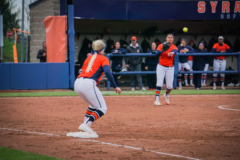 Romero throws the ball over to Sydney O'Hara at first.