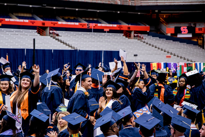 Students take their seats prior to the start of the commencement ceremony. 