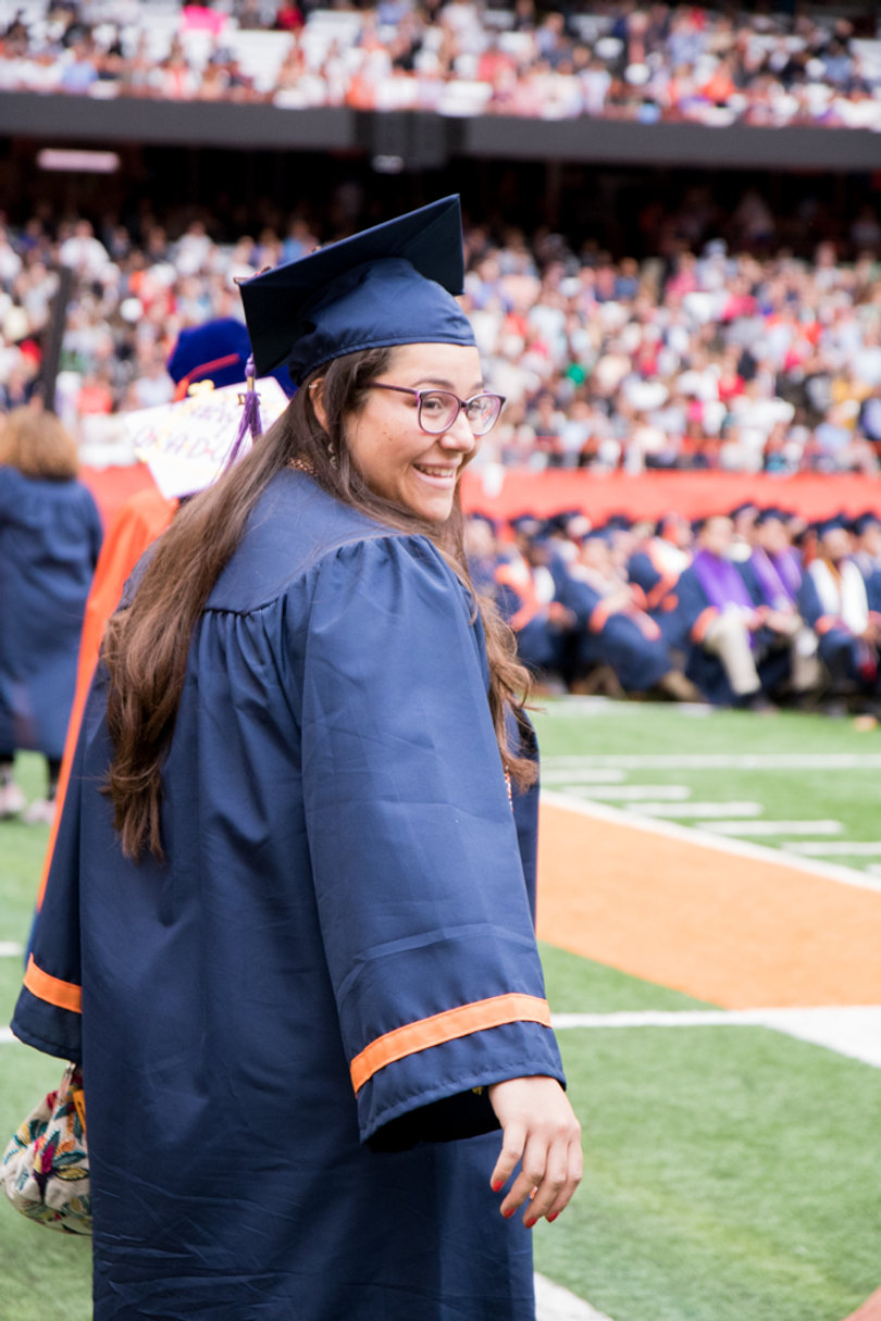 A student enters the Carrier Dome for Sunday's commencement ceremony. 