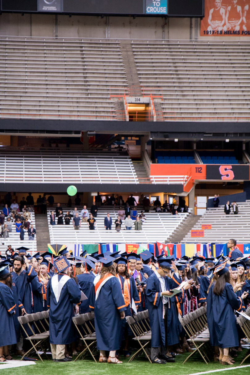 Students wait for the start of the commencement ceremony. 