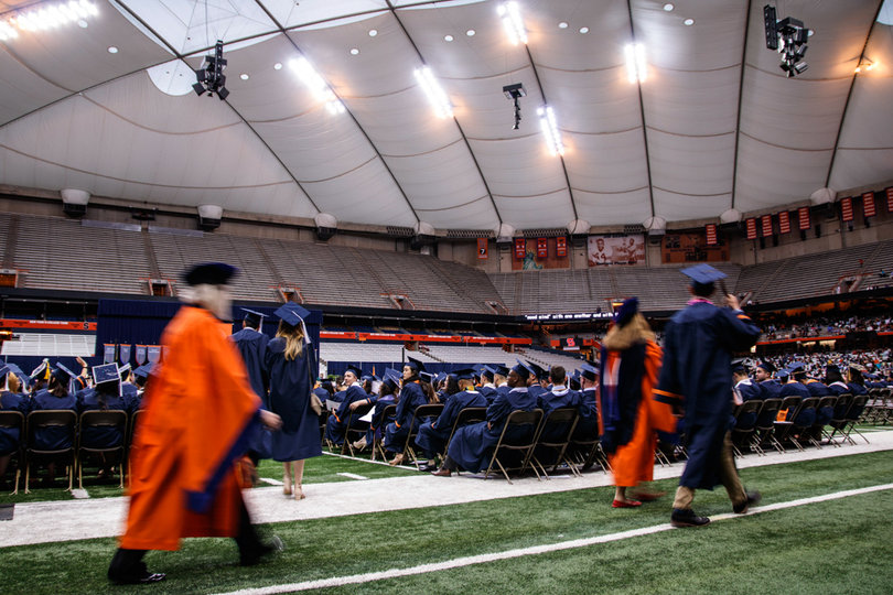 Students, faculty and SU officials take their seats. 