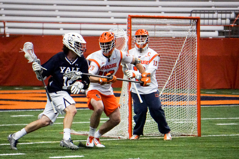 Marcus Cunningham (43), Syracuse's third defender, matched up against Yale's secondary threats. 