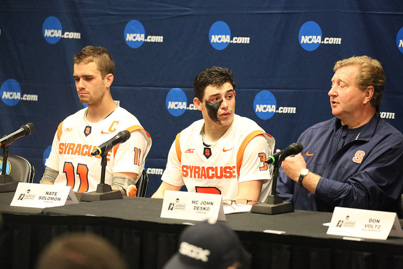 From left: Senior close defender Scott Firman, sophomore attack Nate Solomon and head coach John Desko. 