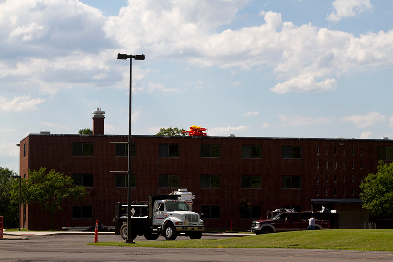 Construction crews are coating the roofs and upgrading the flooring at the Skyhall residence halls on South Campus. Photo taken July 5, 2017