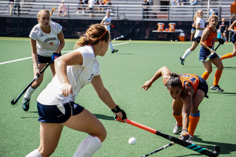 A Syracuse defender pokes the ball away from a Bucknell player. 