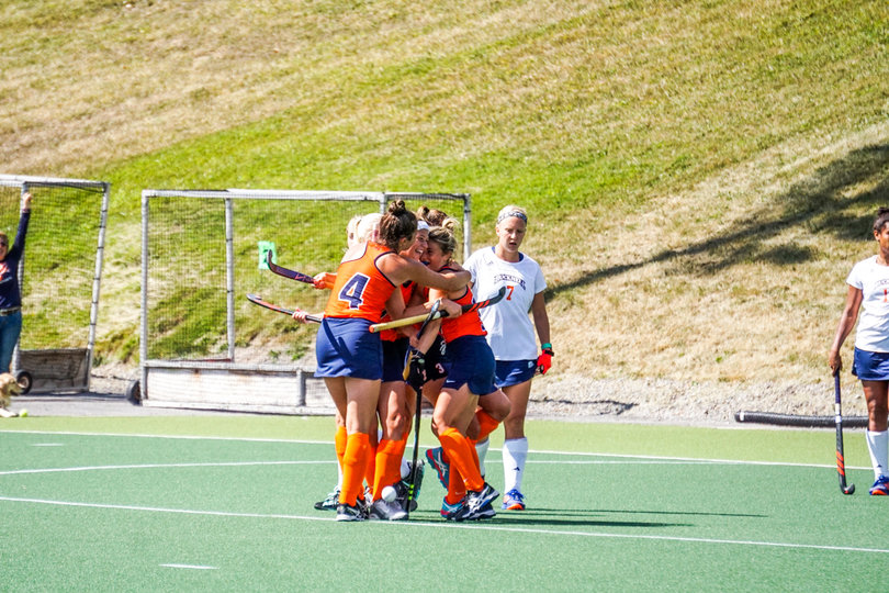 The Orange celebrate one of its five goals in a shutout win. 