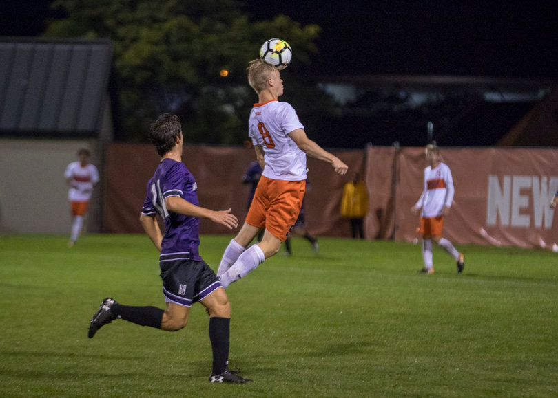Jonathan Hagman heads the ball.