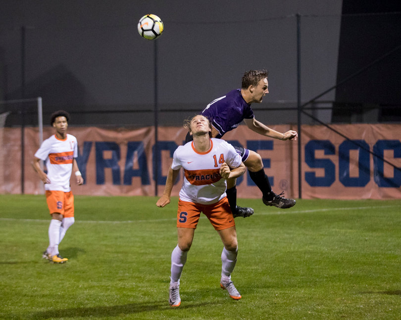 Freshman forward Petter Stangeland heads the ball. 