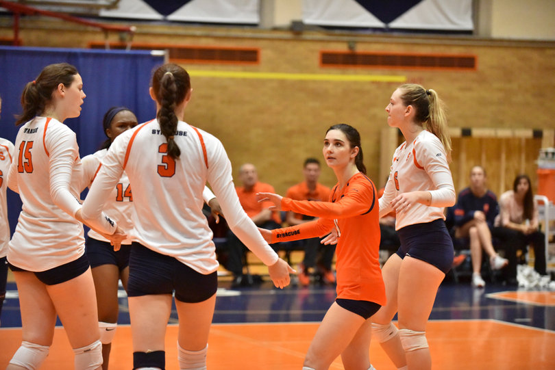 Syracuse celebrates after a point. Though the Orange won, SU only had two aces to Boston College's nine.