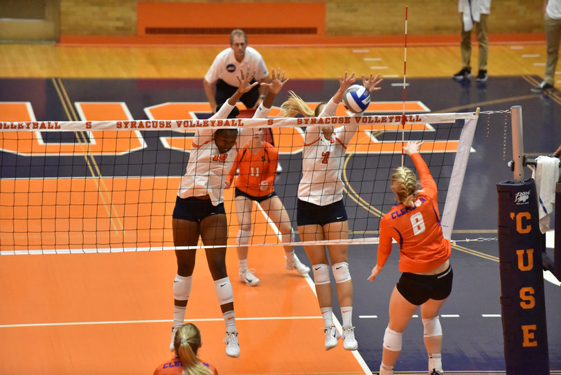Ebangwese combined with outside hitter Ella Saada on this block. 