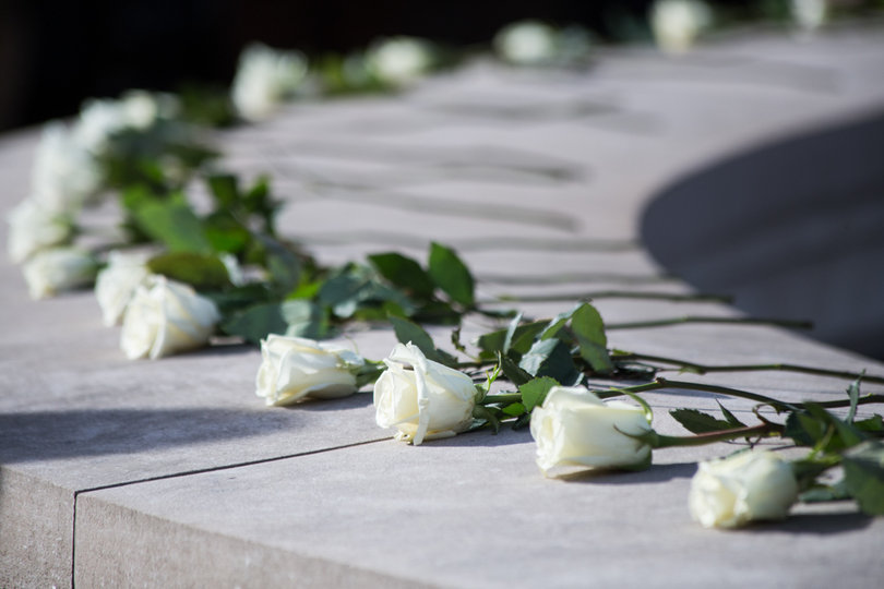 The roses from scholars will remain on the Wall of Remembrance for days.