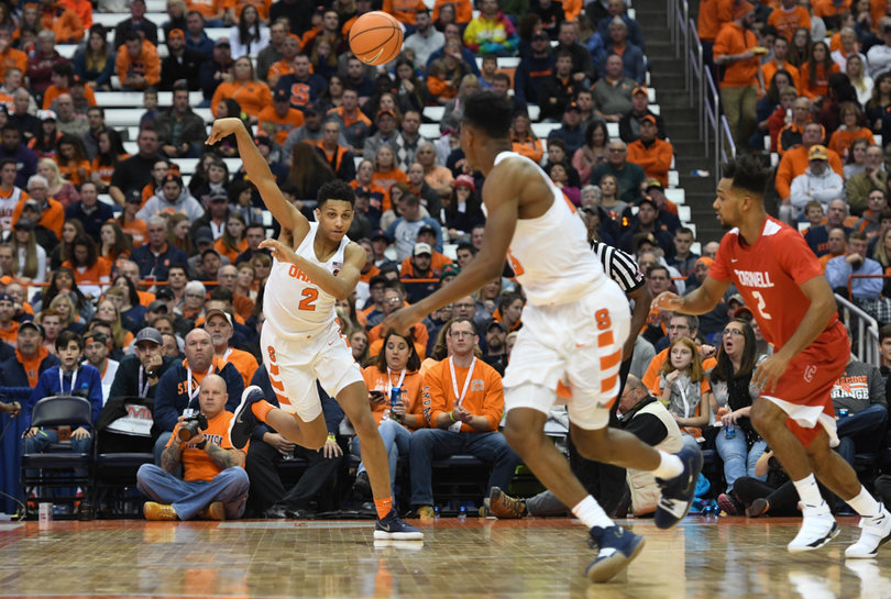 Syracuse forward Matthew Moyer passes the ball down court. Matthew Moyer played 28 minutes, scoring four points and grabbing 10 rebounds.
