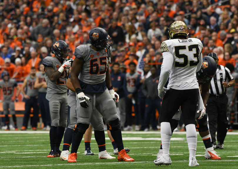 Jamar McGloster and the SU offensive line did its best to protect Mahoney.