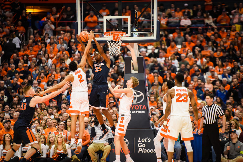 Moyer and Mamadi Diakite meet at the rim.