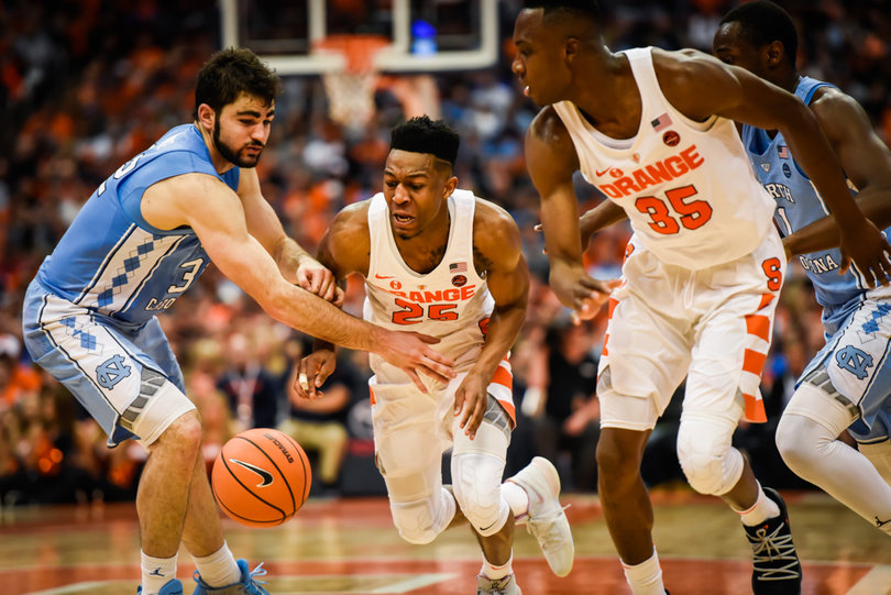 Luke Maye, left, finished with four personal fouls in the game.