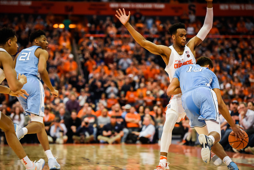 Oshae Brissett attempts to stay in front of UNC's Cameron Johnson.