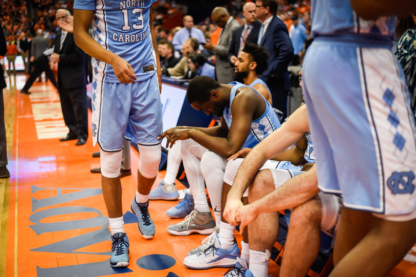 Theo Pinson, head down in center, scored a team-high 23 points for North Carolina. 