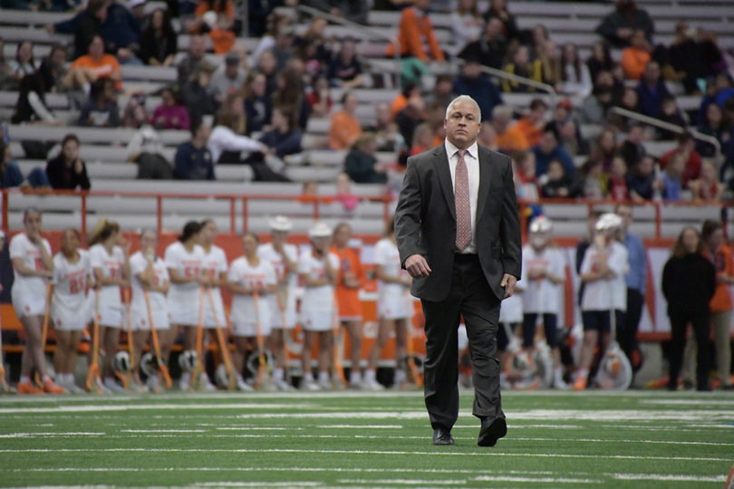Syracuse head coach Gary Gait walks out to midfield after an SU player injury. 