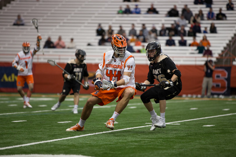 Senior midfielder Matt Lane works on an Army defender.