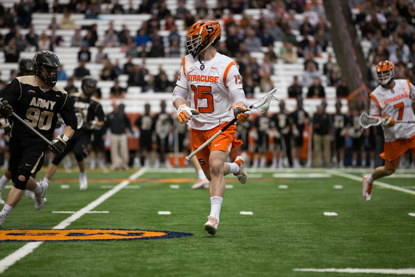 Pat Carlin surveys his options down the field.